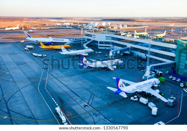 Moscow / Russia - 02.26.2014. Domodedovo\
International Airport. Top view of the apron of Domodedovo airport.\
Planes of Ural Airlines, Rossiya Airlines, Saratov Airlines,\
Transaero Airlines.\
Handling.