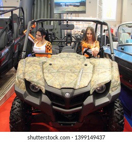 Moscow / Russia – 03 02 2019: ATV Yamaha Viking VI With Show Girls On Display Stand On Exhibition Hunting And Fishing - 2019 At VDNH (VVC, ENEA)