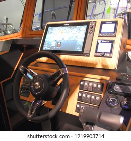 Moscow / Russia – 03 08 2018: Dashboard, Chartplotter Monitor Simrad, Steering Wheel On сaptain's Control Room Cabin Motor Boat At The Russian Yacht Exhibition Moscow Boat Show MBS 2018 In Crocus Expo