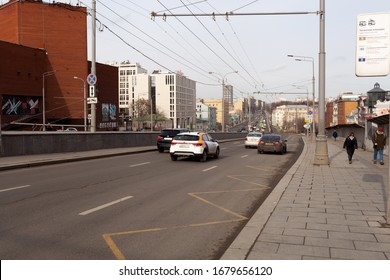 Moscow, Russia - 03/01/2020: The Central Circle Road With The Cars On It, And Some People Walking Along Pedestrian Area.