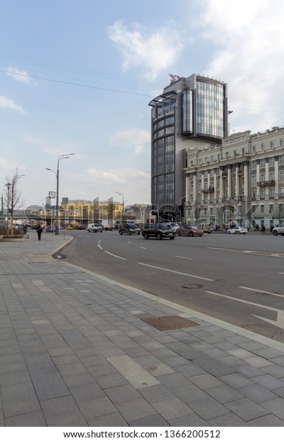 Moscow, Russia -\
04/09/2019: Zubovsky Boulevard road with cars, people and buildings\
during the day time.