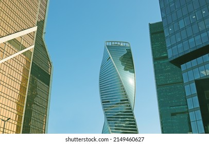 Moscow, Russia -04.17.22: Moscow International Business Center. Evolution tower in DNA shape between two office skyscrapers. Office buildings exterior. Urban building design. High-risers, modern city