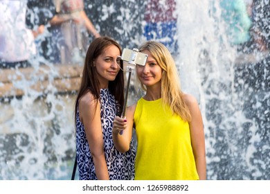 Moscow / Russia - 06 19 2018: 
Young Girls Take A Selfie At The Fountain 