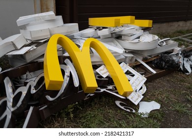 Moscow, Russia - 06.21.2022: McDonalds Logo Letter Character M On Dirty Rubbish Heap Dump Trash Litter Garbage. Fast Food And Sanctions Concept. Environment Issues