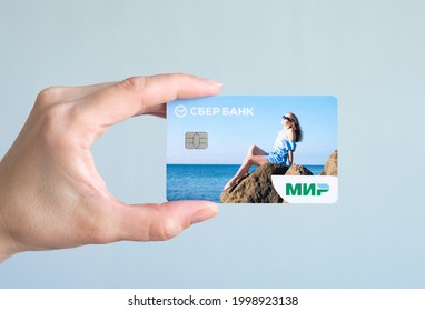 Moscow, Russia - 06.29.2021: Russian Bank Card Of The MIR Payment System In A Woman's Hand.