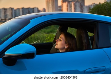 Moscow, Russia 07-02-02019 Porsche 911 Carrera 4S (Miami Blue) 992 Sports Beautiful Caucasian Woman Car Goes Away Into The Distance In The Sun And Sun Rays. Sports Car Is Driving In The Parking Lot. 