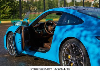 Moscow, Russia 07-02-02019 Porsche 911 Carrera 4S (Miami Blue) 992 Sports The Front Door Of The Car Is Open And The Brown Leather Interior Of The Car Is Visible. High Quality Photo