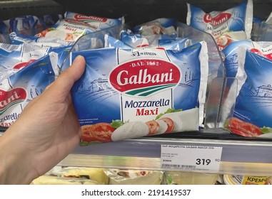 Moscow, Russia - 08.18.2022: Hand Holds A Pack Of Galbani Mozzarella Cheese. Italian Mozzarella Cheese On A Shelf In A Grocery Store. Food Price Increase. Import Problems. Food Prices Inflation.