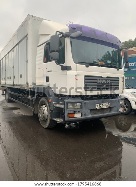 Moscow, Russia - 13 August 2020: Man\
semi trailer parked outside in residential\
area.
