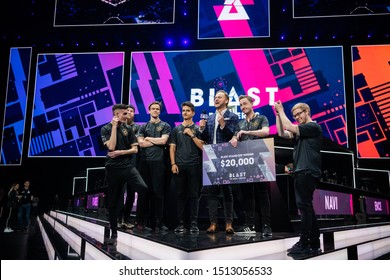 MOSCOW, RUSSIA - 14th SEPTEMBER 2019: Esports Event Of A Counter Strike Game. Winners Of A Standoff Tournament Team Ninjas In Pyjamas With A Check In Their Hands With A Prize Money.