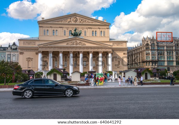 Moscow, Russia - 16 August 2016: Bolshoi\
Theater, Ohotniy Ryad street. The most famous theatre of Russia.\
Thousands of tourists annually visit the theatre in Moscow. Luxe\
car in front of the\
theater.