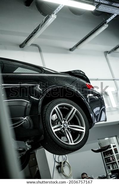 Moscow, Russia - 17.08.2021: Luxury\
BMW M6 E63 in the auto service repair shop on engine\
repair