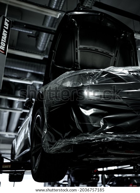 Moscow, Russia - 17.08.2021: Luxury\
BMW M6 E63 in the auto service repair shop on engine\
repair