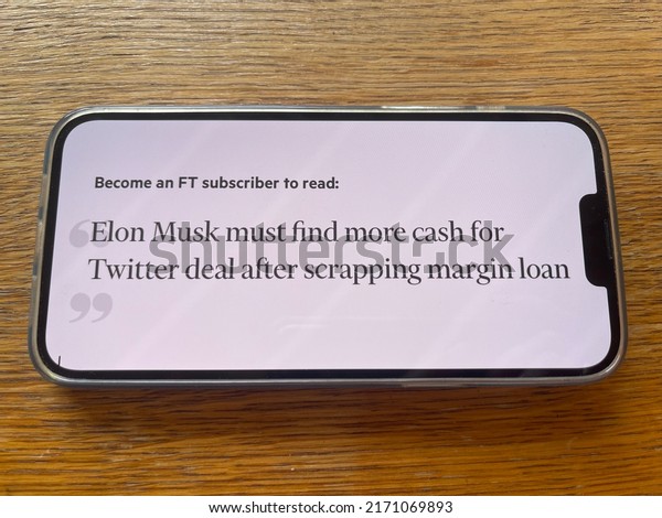 Moscow, Russia - 21 of June 2022:\
Financial Times news headlines Elon Musk must find more cash for\
Twitter deal after scrapping margin loan. Mobile phone\
screen.