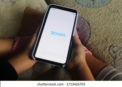 Moscow, Russia - 24 April 2020: Zoom Meetings App Logo Displayed Full-screen On A Mobile Phone Screen. Child Is Using An App At Home.