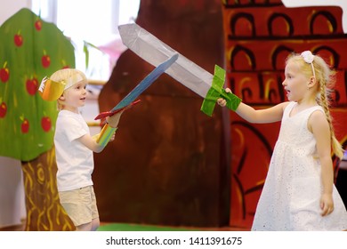 Moscow, Russia - 25 May , 2019: Little Kids Involved In Performance Theatre Studio. Sword Fighting. Children Playing Greek Heroes On Stage In Theater. Activities And Entertainment.