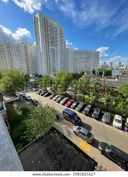 Moscow, Russia - 25 of May 2021: Parking lot\
with Post delivery van parked outside in residential area.\
Translation in Russian means The Post of\
Russia.
