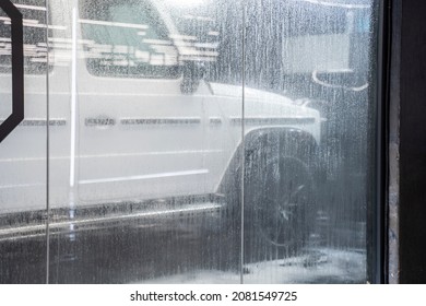 Moscow, Russia 26 November 2021: The Car Behind The Glass In The Waiting Area At The Car Wash In The Process Of Washing With Foam Mercedes-Benz G63 Amg