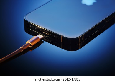 Moscow, Russia, 26,03.2022 - Bottom part of new apple iphone 13 pro with proprietary lightning charger connector and cable jacker, speaker and microphone. Iphone 13pro smartphone. Apple gadgets.