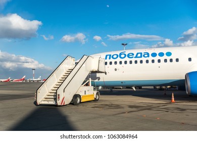 MOSCOW, RUSSIA - 28 March 2018: The Ramp At The Airport By The Plane Boeing 737-800 Of Pobeda Airlines