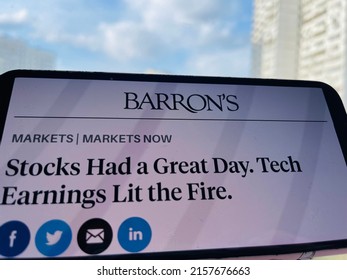 Moscow, Russia - 29 Of April 2022: Barron’s News With Headlines Stocks Had A Great Day, Tech Earnings Lit The Fire On A Smartphone Screen.