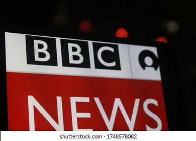 Moscow, Russia - 3 June 2020: Close-up of BBC News icon on a mobile phone screen. Window lights on the background.