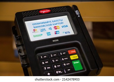 Moscow, Russia. 30th of March, 2022. A payment terminal with logos of available cashless payment systems is installed at the ticket office of the railway station in Moscow, Russia