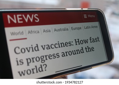 Moscow, Russia - 9 March 2021: BBC News With  Covid Vaccines, How Fast Is Progress Around The World Headlines On A Smartphone Screen. Selective Focus.