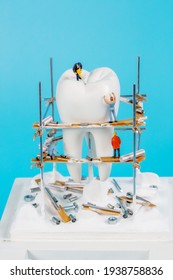 Moscow, Russia - 9th Matra 2021: A Model Of A Human Tooth And An Art Installation Of Small Figures Around It. Tooth Reconstruction, Dental Concept.