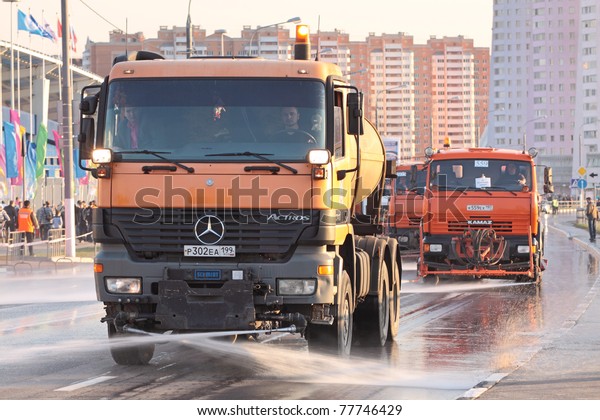 MOSCOW, RUSSIA - APR 26: Trucks wash the\
city street after the passage of the military equipment for the\
rehearsal of the parade on April 26, 2011 in\
Moscow.