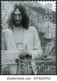 MOSCOW, RUSSIA - APRIL 04, 2021: A Stamp Printed In Gibraltar Shows John Winston Ono Lennon (1940-1980), Singer And Songwriter, Marriage Ceremony, 1999