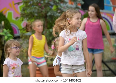 MOSCOW, RUSSIA - April 12, 2019 A large group of happy fun sports kids jumping, sports and dancing. Childhood, freedom, happiness, the concept of an active lifestyle