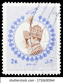 MOSCOW, RUSSIA - APRIL 18, 2020: Postage Stamp Printed In Iran Shows Mohammad Reza Shah Pahlavi With Wife Farah Diba, Coronation Of The Emperor And Empress Serie, Circa 1967