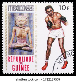 MOSCOW, RUSSIA - APRIL 18, 2020: Postage Stamp Printed In Guinea Shows Boxing, Summer Olympics 1968, Mexico Serie, Circa 1969