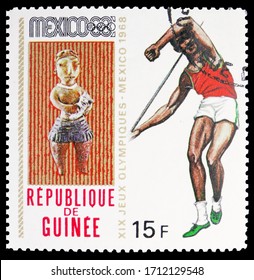 MOSCOW, RUSSIA - APRIL 18, 2020: Postage Stamp Printed In Guinea Shows Javelin Throw, Summer Olympics 1968, Mexico Serie, Circa 1969