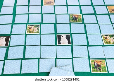 MOSCOW, RUSSIA - APRIL 2, 2019: Gameboard Of Concentration (Memory) Card Game With Animal Theme On Green Baize Table. The Object Of The Game Is To Find Pairs Of Matching Cards