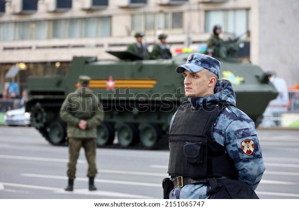 Moscow, Russia - April 2022: Russian soldiers\
standing in front of amphibious floating armored personnel carrier\
BTR-MDM \