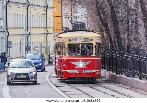 Moscow, Russia - April 21, 2019:\
Vintage tram on the town street in the historical city\
center.