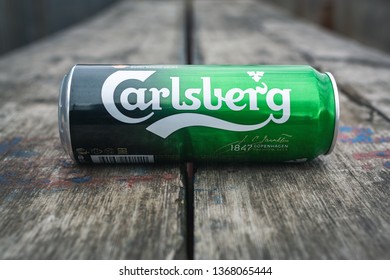 MOSCOW, RUSSIA April 7, 2019: Carlsberg lager on wooden boards