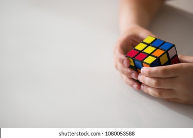 Moscow, Russia, August 16 2017: Boy Holding Rubik's Cube And Playing With It. Rubik's Cube In Child's Hands, Closeup.