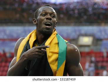 MOSCOW, RUSSIA - AUGUST 17: Usain Bolt celebrates his win at the World Athletics Championships on August 17, 2013 in Moscow