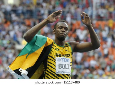 MOSCOW, RUSSIA - AUGUST 17: Usain Bolt celebrates his win at the World Athletics Championships on August 17, 2013 in Moscow