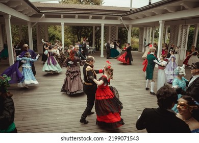 Moscow, Russia - August 19, 2022: Beautiful People Whirling In The Dance At Masquerade Ball In Historical Costumes And Masks.