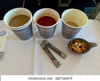 Moscow, Russia - August, 2020: Tomato juice and cappuccino on board an Aeroflot aircraft in business class
