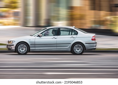 Moscow, Russia - August 2022: BMW 330i E46 Car Moving On Streets, Side View. Silver Sedan Auto BMW In Motion