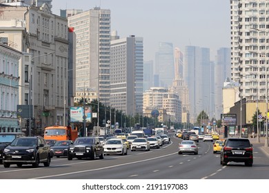 Moscow, Russia - August 2022: Cars On The Novy Arbat Street In Downtown. View To Skyscrapers Of Moscow City In Smog