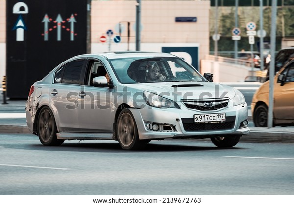 Moscow, Russia - August 2022: Subaru Legacy\
Fifth generation BM on the city street. Broken Subaru Liberty car\
with driver rides on the road on high\
speed