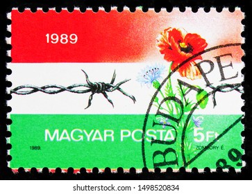 MOSCOW, RUSSIA - AUGUST 21, 2019: Postage Stamp Printed In Hungary Shows Dismantling Of The Iron Curtain, Events Serie, Circa 1989