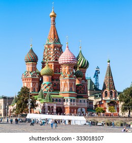 MOSCOW, RUSSIA - AUGUST 23, 2015: Saint Basil Cathedral (Pokrovsky Cathedral) and Vasilevsky Descent of Red Square of Moscow Kremlin in summer afternoon. This is the central square of Moscow city.