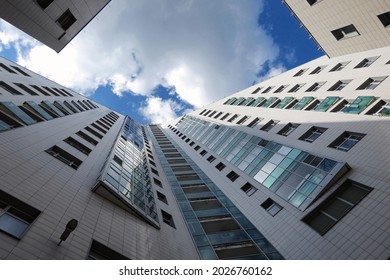 Moscow, Russia - August 3 2021: Diminishing Perspective Of Wall Of Modern Residential Skyscraper In Moscow Under Blue Sunny Sky